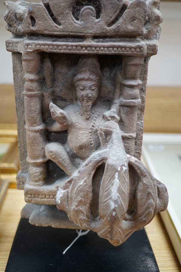 An Indian Hindu sandstone carving of Brahma the Creator, 14th century, 33cm high overall. Condition - commensurate with age